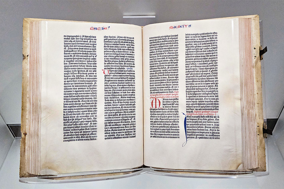 Photograph of Gutenberg's B42 Bible on display at the U.S. Library of Congress. The Gutenberg Bible remains on public display in the Great Hall of the Jefferson Building.