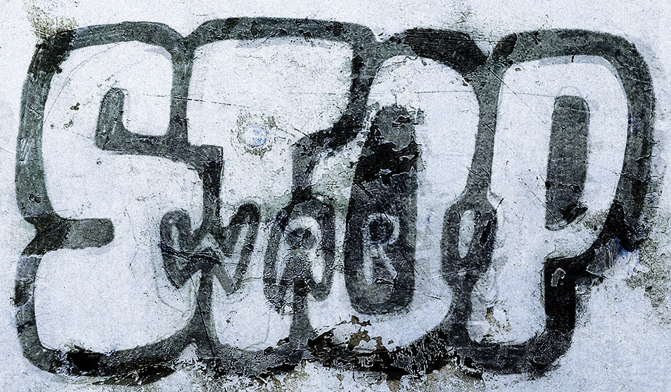 The words 'STOP WAR!' in bold letters, the second word is written in the spaces between or inside the letters of the first word. They look like they're painted on a decrepit wall, graffiti style, but they were actually drawn by hand and then photo composed with wall textures.