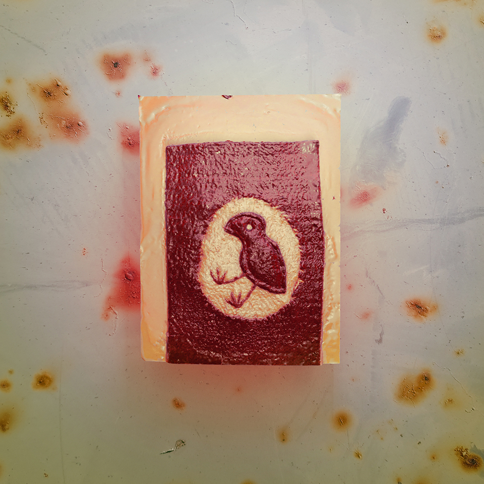 3D render of a 3D-scanned felt piece featuring a childish-looking embroidery of a bird with long legs inside of an egg, the piece appears to be made of a plastic, light-reflectant material (or maybe a bio-material like a Kombucha scoby) and it looks like it's floating above a textured metal background with rusty nails.